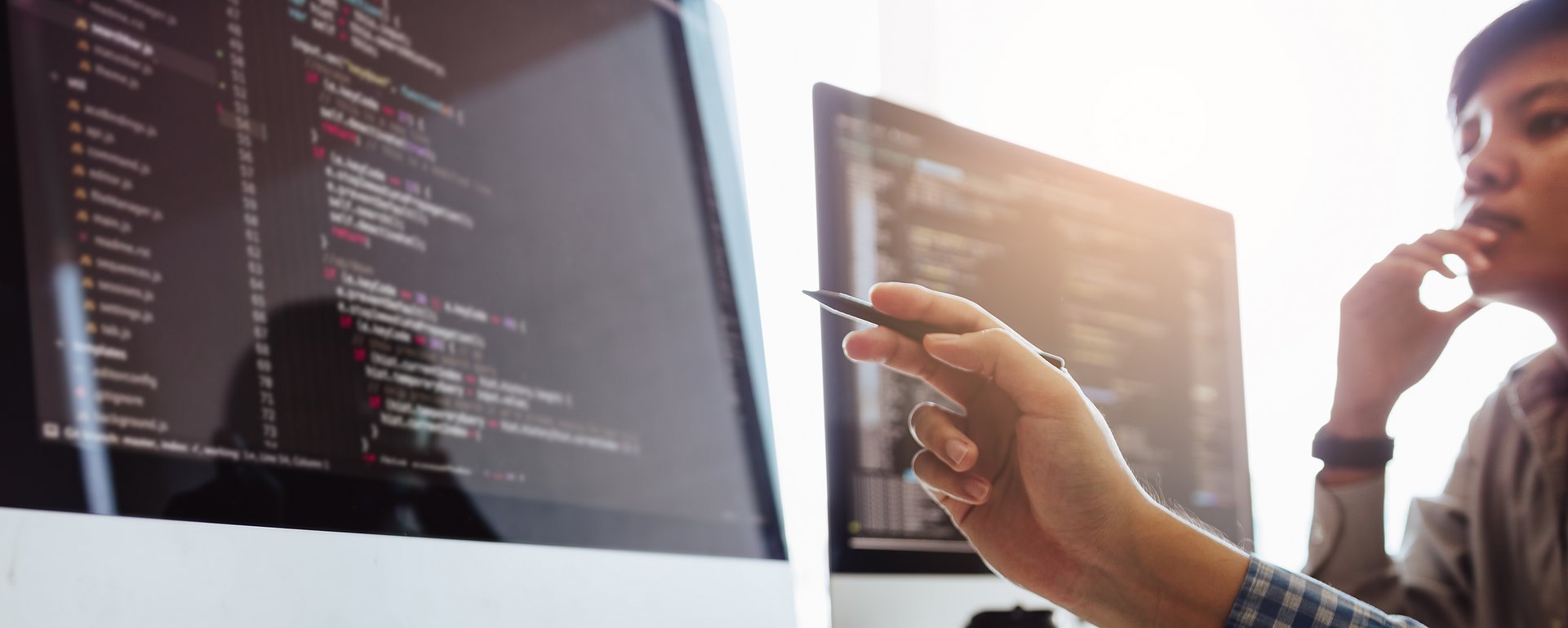 Developing programming and coding technologies working in a software engineers developing applications together in office. Developing programming and coding technologies working in a software engineers developing applications together in office.