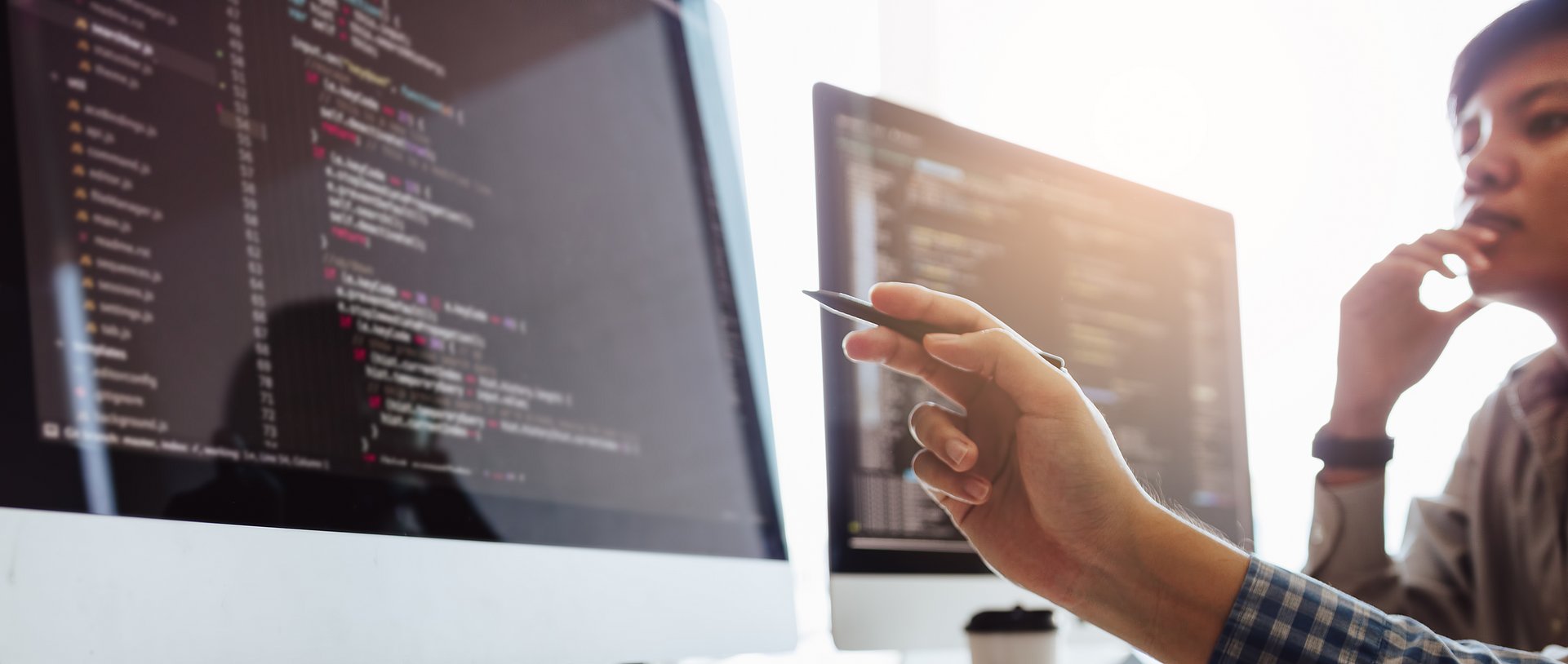 Developing programming and coding technologies working in a software engineers developing applications together in office. Developing programming and coding technologies working in a software engineers developing applications together in office.